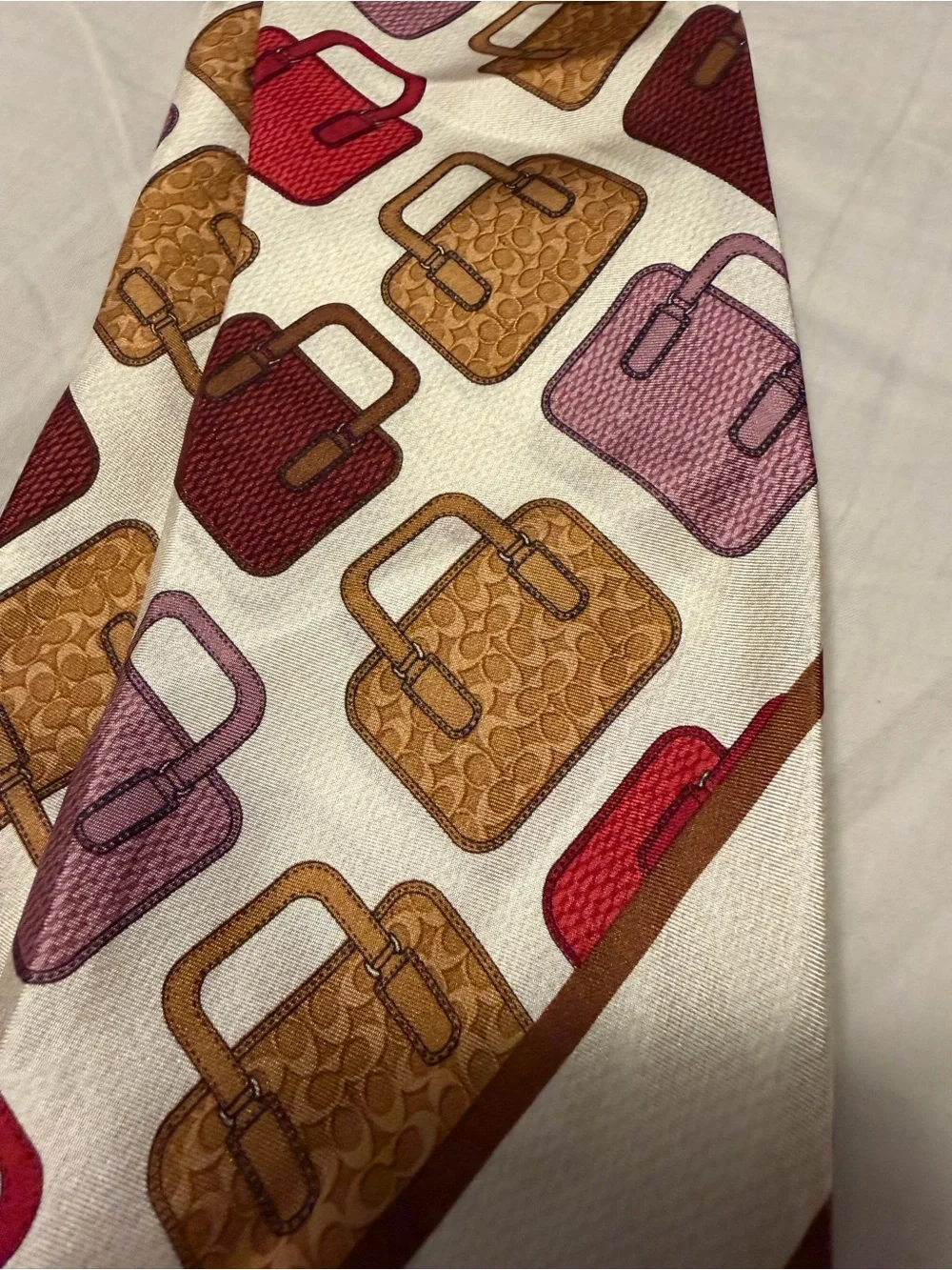 Coach Cream Scarf with Brown, Gold, Red and Pink Handbag Motif